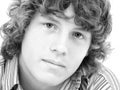 Close Up of Sixteen Year Old Teen Boy in Black and White Royalty Free Stock Photo