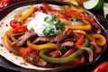 Close-up of sizzling Fajitas with juicy strips of grilled beef, vibrant bell peppers, and onions