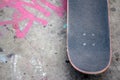 Close up of a skateboard deck on the asphalt, photographed from