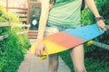 Close-up skateboarder girl with skateboard outdoor at skatepark Royalty Free Stock Photo