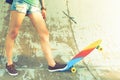 Close-up skateboarder girl with skateboard outdoor at skatepark Royalty Free Stock Photo