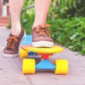 Close-up skateboarder riding by skateboard outdoor. Skatebord at city, street Royalty Free Stock Photo