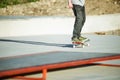 Close-up Skateboarder`s legs skateboard on concrete. Skating On skateboard popular youth extreme sports