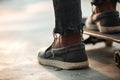 Close up of skateboarders feet standing