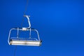 close-up of a ski lift against a background of blue sky with clouds. Royalty Free Stock Photo