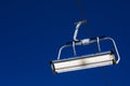 close-up of a ski lift against a background of blue sky with clouds. Royalty Free Stock Photo