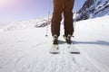 Close-up of skier skiing with panorama of high mountains