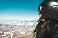 Close up skier snowboarder female person portrait with goggles look out to mountains panorama reflection. Ski holiday in Georgia