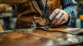 Artisan leatherworker sewing a piece with focus and precision in workshop Royalty Free Stock Photo