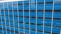 close up of skyscraper glass, abstract building background. View of a modern glass skyscraper reflecting. Blue toned Royalty Free Stock Photo