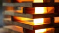 A close up of a sleek modern lamp made entirely from stacked and sanded pallets. Soft warm light emanates from the lamp