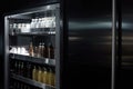 close-up of sleek and modern walk-in refrigerator, with bottles and cans visible