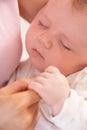 Close Up Of Sleeping Baby Boy Holding Mothers Hand Royalty Free Stock Photo