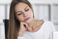 Close up of sleeping blond girl in a white office