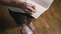 Close-up of slender man bare legs take step on white bathroom scale. The male checks his weight after training at home. Man Royalty Free Stock Photo