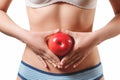 Close up. slender slim figure waist belly young woman girl. Holding a juicy red Apple. isolated on white background Royalty Free Stock Photo