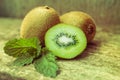 Close up slice of fresh kiwi fruit on old wood background. Royalty Free Stock Photo