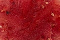 close-up of a slice inside a watermelon, a red surface with black seeds has a place for copying the text. Background and texture Royalty Free Stock Photo