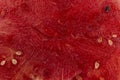 close-up of a slice inside a watermelon, a red surface with black seeds has a place for copying the text. Background and texture Royalty Free Stock Photo