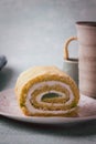 Close up of slice of pandan roll cake