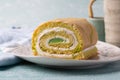 Close up of slice of pandan roll cake