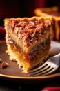 close-up of a slice of pecan pie with a fork Royalty Free Stock Photo