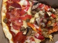 Close-up Slice of Supreme Pizza Carryout Royalty Free Stock Photo