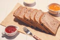 Close-up of slice of toast bread with jam and butter on wood tab Royalty Free Stock Photo