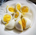 Close-up of sliced hard-boiled eggs on a white plate Royalty Free Stock Photo