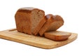 close-up of sliced loaf of rye bread on cutting board on white background Royalty Free Stock Photo