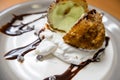 Fried ice cream with chocolate syrup and cream on plate Royalty Free Stock Photo