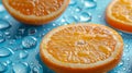 Close-up of a sliced orange with water droplets on a blue background