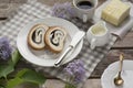 Close up of sliced poppy seed roll on white plate