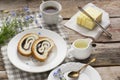 Close up of sliced poppy seed roll on white plate