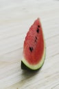 Close up of sliced watermelon fruit on wooden table backgrounds Royalty Free Stock Photo