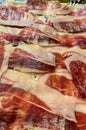 Slices spanish dried pork also known as Jamon Serrano. Typical tapa Iberian ham Royalty Free Stock Photo