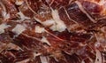 Slices spanish dried pork also known as Jamon Serrano. Typical tapa Iberian ham Royalty Free Stock Photo