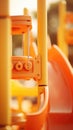 A close up of a slide in an orange playground, AI