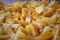 Homemade candied orange and lemon peel. Angled macro background. Royalty Free Stock Photo