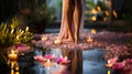 Close-up of slim sexy female legs in spa setting with candles and flowers Royalty Free Stock Photo