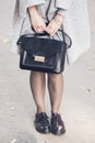 Woman legs wearing black shoes on the street Royalty Free Stock Photo