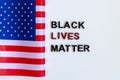 Close up Slogan Black lives matter tag. American Flag. Royalty Free Stock Photo