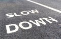 Close up slow down marking on street, for warning the drivers to Royalty Free Stock Photo
