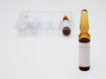 Close-up of small ampoule with empty label