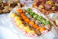 Close up of small canapes arranged on a plate over light background Royalty Free Stock Photo