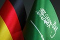 Close-up of small flags of Germany and Saudi Arabia.