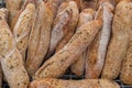 A close up of small freshly baked rustic baguettes for sale at a farmers market Royalty Free Stock Photo