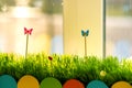 Close up of small green grass with special cute toys small butterflies. Concept of beautiful plants with decoration