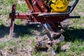 Close up of small hand tractor motoblock for plowing field Royalty Free Stock Photo