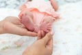 Close-up of the small legs of a newborn baby in the hands of a woman or mother. Moments with a child Royalty Free Stock Photo